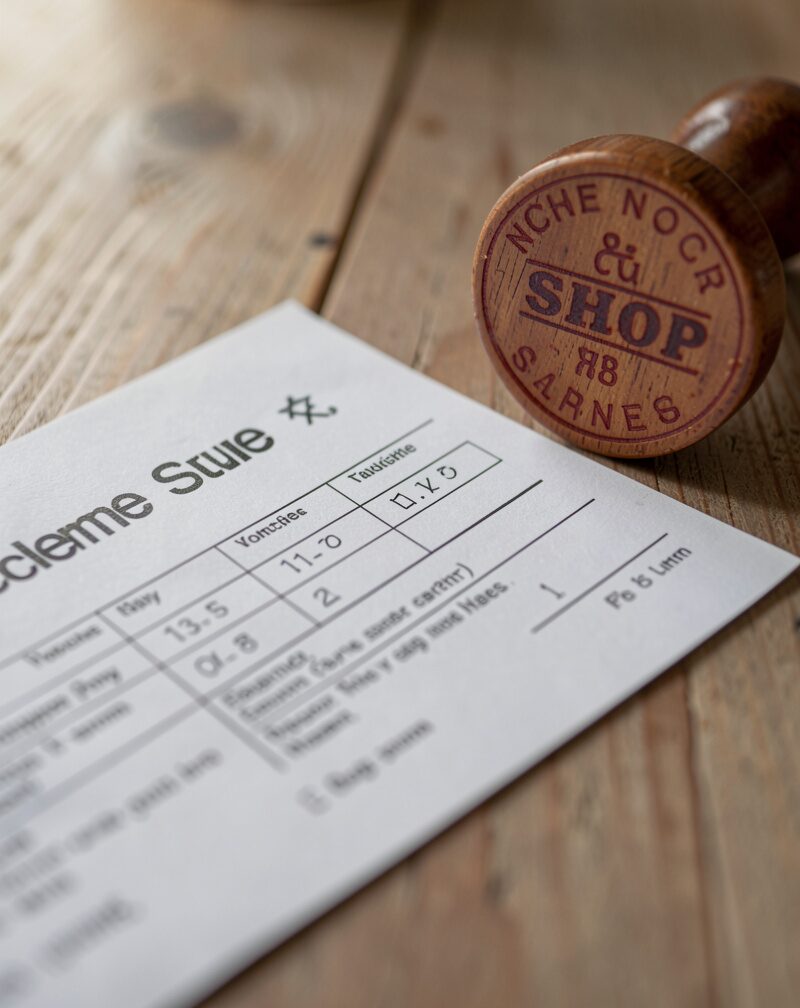 Close-up of a scheme voucher form and a shop stamp